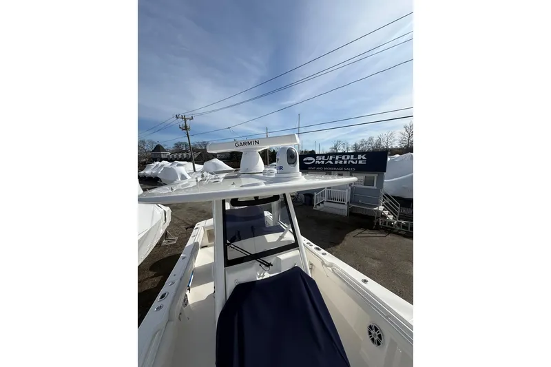 Slide: The Image of 2024 Regulator 28 Forward Seating boat at Suffolk Marine dealership. - 16
