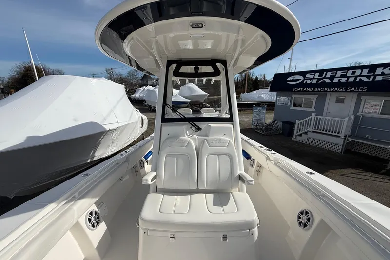 Slide: The Image of 2024 Regulator 28 Forward Seating boat at Suffolk Marine dealership. - 33