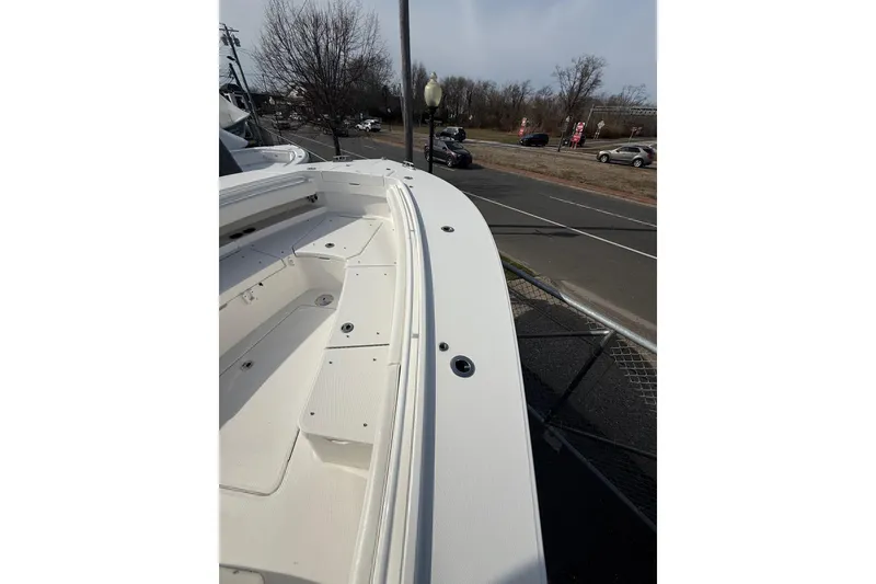 Slide: The Image of 2024 Regulator 28 Forward Seating boat, showcasing sleek design and spacious deck. - 36