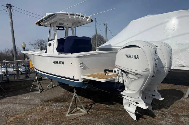 Slide: The Image of 2024 Regulator 28 Forward Seating boat with twin Yamaha engines on display. - 6