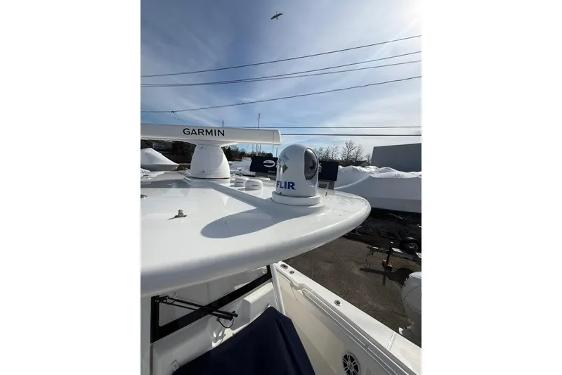 Slide: The Image of 2024 Regulator 28 Forward Seating boat with Garmin and FLIR equipment on deck. - 8