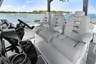 Slide: The Image of 2023 HCB 39 Speciale boat interior with luxurious seating and modern dashboard. - 21