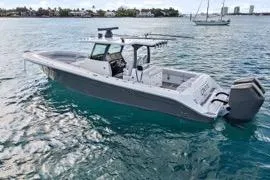 Slide: The Image of 2023 HCB 39 Speciale boat on calm water, showcasing sleek design and powerful engines. - 4