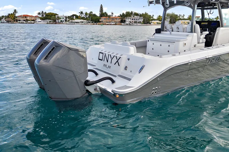 Slide: The Image of 2023 HCB 39 Speciale boat with dual engines on clear water. - 6
