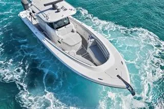 Slide: The Image of 2023 HCB 39 Speciale boat cruising in clear blue ocean waters. - 8