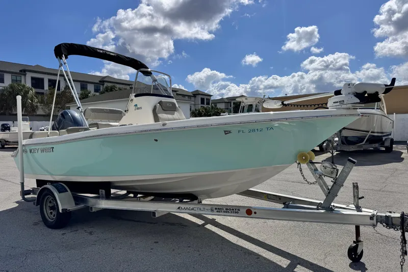 Slide: The Image of 2021 Key West 189 FS boat on trailer under a partly cloudy sky. - 6