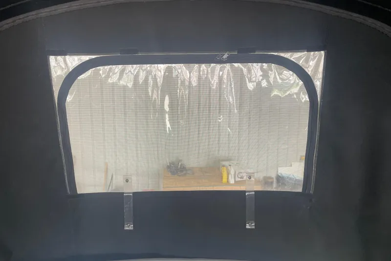 Slide: The Image of Clear window on 2006 Sea Ray Sundancer 260 boat enclosure, interior view. - 11