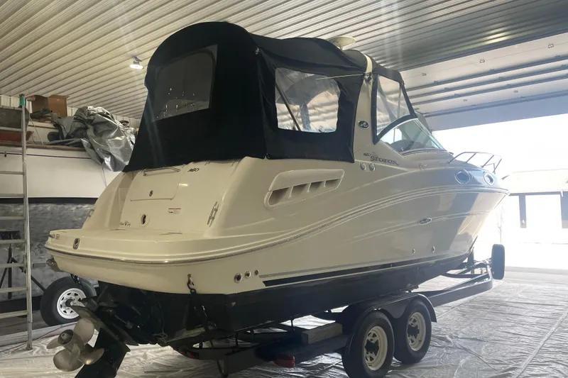 Slide: The Image of 2006 Sea Ray Sundancer 260 boat on trailer in indoor storage. - 4