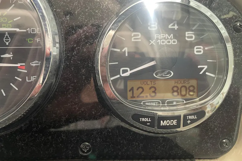 Slide: The Image of Close-up of 2006 Sea Ray Sundancer 260 dashboard showing RPM, volts, and engine hours. - 9