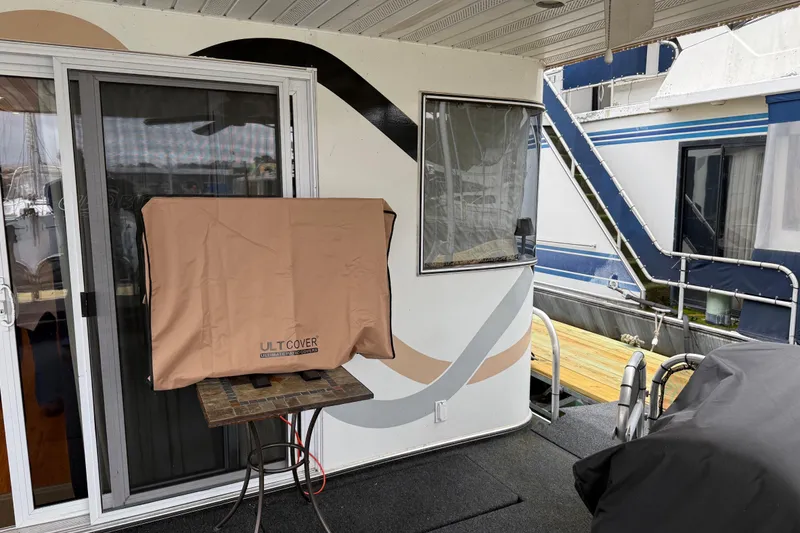 Slide: The Image of Covered outdoor area on a 2001 Sharpe 80 X 18 houseboat with sliding glass door. - 104