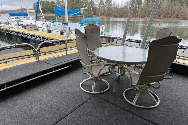 Slide: The Image of Outdoor seating on 2001 Sharpe 80 X 18 houseboat deck by marina. - 106