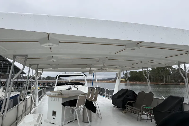 Slide: The Image of Upper deck of 2001 Sharpe 80 X 18 houseboat with seating and covered area. - 108