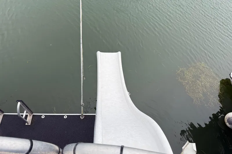 Slide: The Image of Boat slide leading into water, Sharpe 80 X 18, 2001 model. - 112