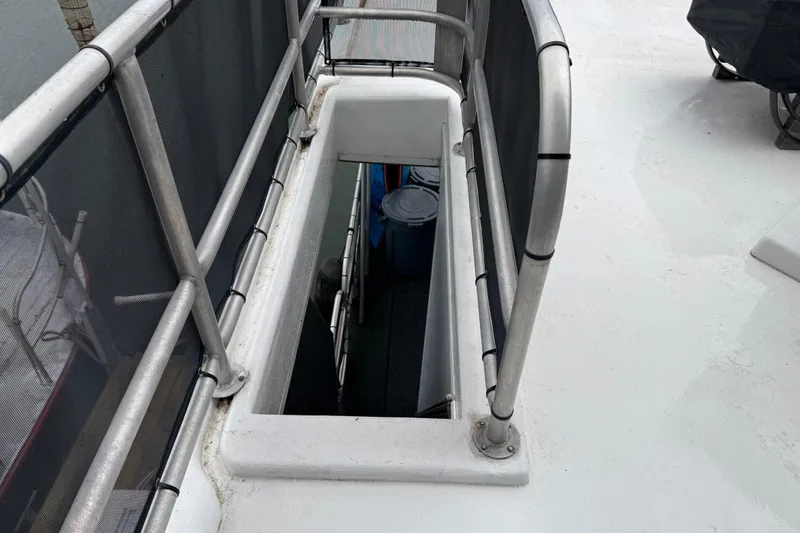 Slide: The Image of Stairway on 2001 Sharpe 80 X 18 boat deck, featuring metal railings. - 115