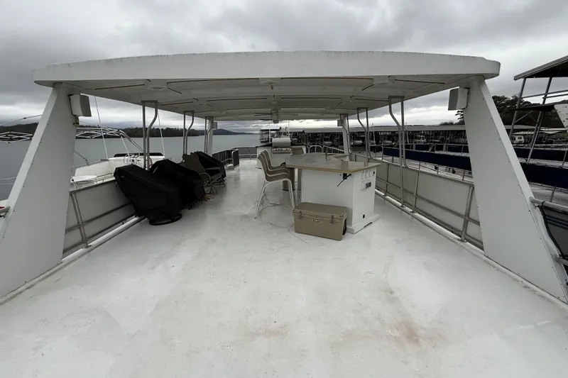 Slide: The Image of Upper deck of 2001 Sharpe 80 X 18 houseboat with seating and covered area. - 119