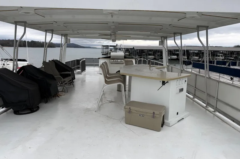 Slide: The Image of Spacious deck of 2001 Sharpe 80 X 18 houseboat with seating and table. - 120