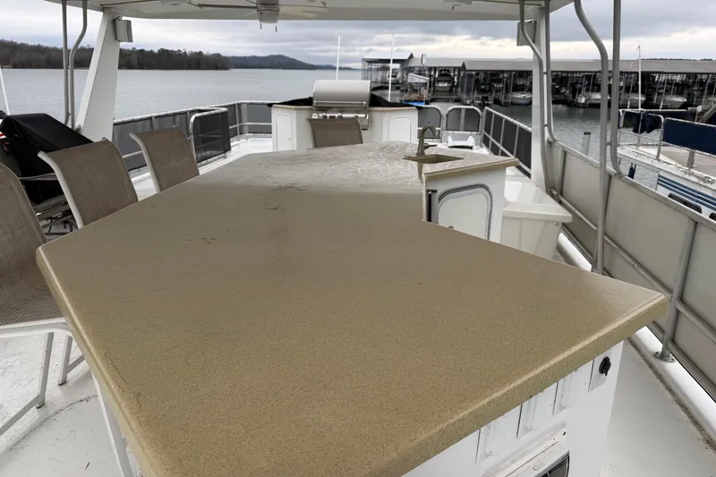 Slide: The Image of Upper deck of 2001 Sharpe 80 X 18 houseboat with seating and lake view. - 122