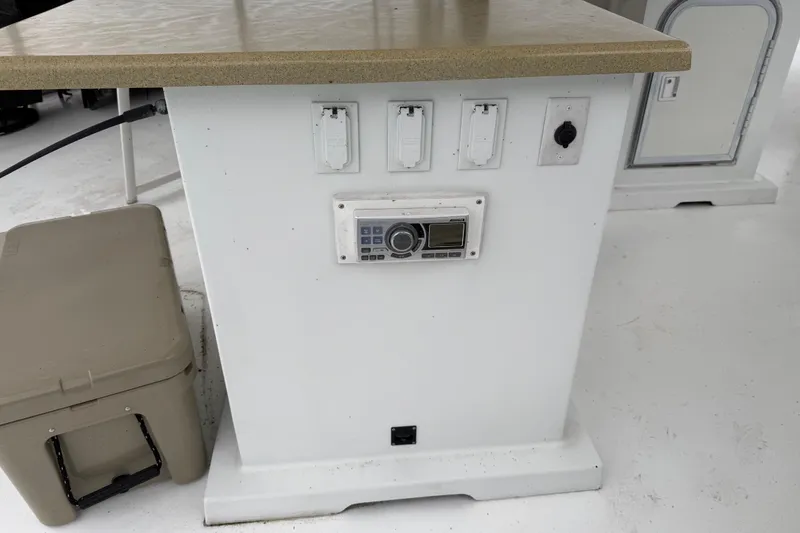 Slide: The Image of Control panel on a 2001 Sharpe 80 X 18 boat with outlets and radio. - 125