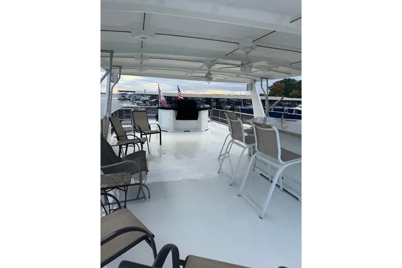 Slide: The Image of Spacious deck of 2001 Sharpe 80 X 18 houseboat with seating and marina view. - 139