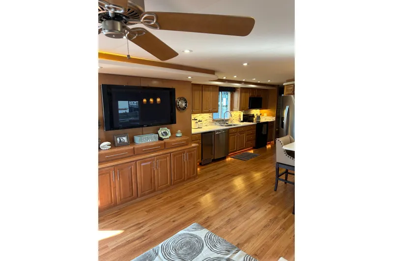 Slide: The Image of Luxurious kitchen interior in 2001 Sharpe 80 X 18 houseboat with modern appliances and wood cabinetry. - 144