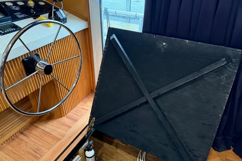 Slide: The Image of Steering wheel and control panel of 2001 Sharpe 80 X 18 boat interior. - 17