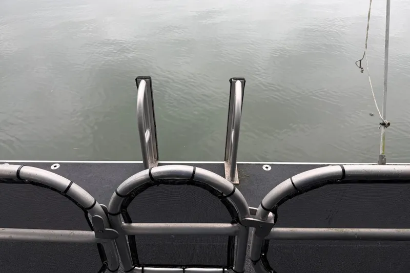 Slide: The Image of Boat deck with metal railing and ladder, Sharpe 80 X 18, 2001 model. - 32