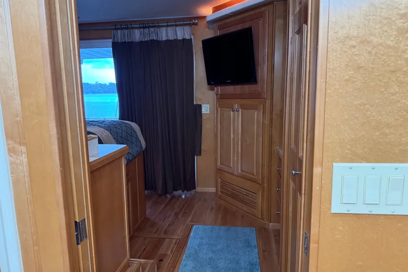 Slide: The Image of Interior of 2001 Sharpe 80 X 18 houseboat with wood paneling and a mounted TV. - 36