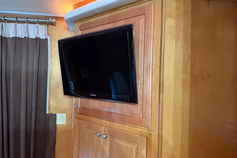 Slide: The Image of Wall-mounted Samsung TV in a 2001 Sharpe 80 X 18 houseboat interior. - 47