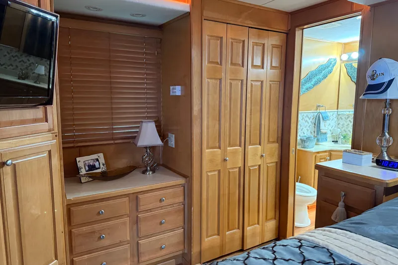 Slide: The Image of Interior of 2001 Sharpe 80 X 18 houseboat with wooden cabinets and bathroom view. - 49