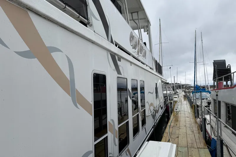 Slide: The Image of Houseboat docked at marina, Sharpe 80 X 18, 2001 model, overcast sky. - 5
