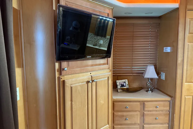 Slide: The Image of Interior of 2001 Sharpe 80 X 18 with TV, wooden cabinets, and lamp. - 50