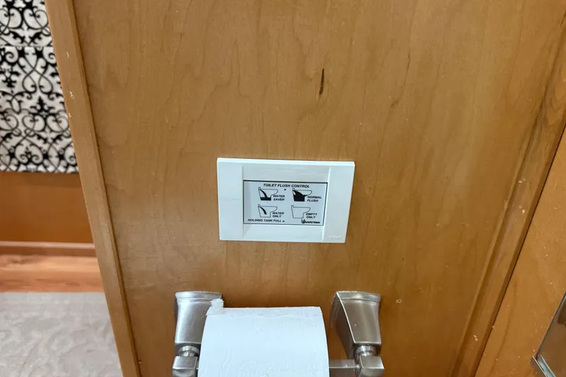 Slide: The Image of Control panel for toilet flush options on wooden wall, Sharpe 80 X 18, 2001 model. - 56