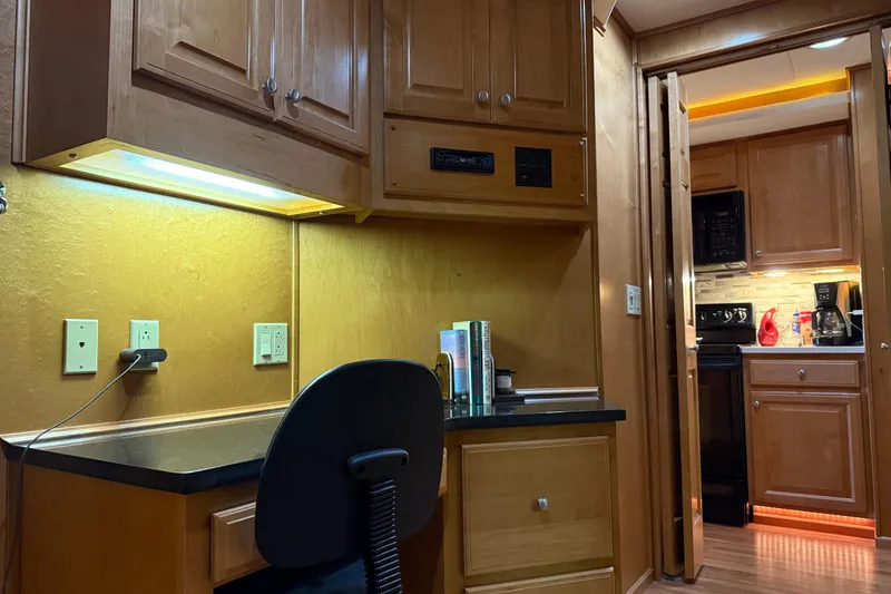 Slide: The Image of Office space in 2001 Sharpe 80 X 18 houseboat with wooden cabinets and kitchen view. - 69