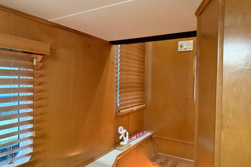 Slide: The Image of Interior of 2001 Sharpe 80 X 18 houseboat with wooden paneling and blinds. - 72