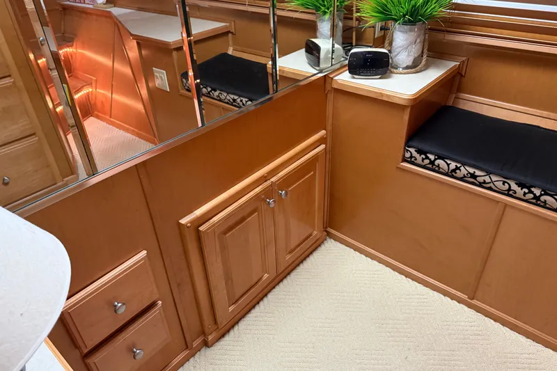 Slide: The Image of Interior of 2001 Sharpe 80 X 18 houseboat with wood cabinetry and decorative plants. - 75