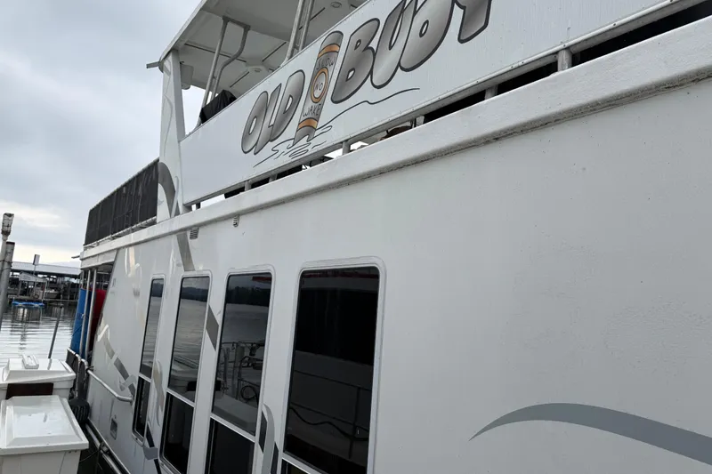 Slide: The Image of Houseboat "Old Boot" docked, Sharpe 80 X 18, 2001 model, overcast sky. - 8