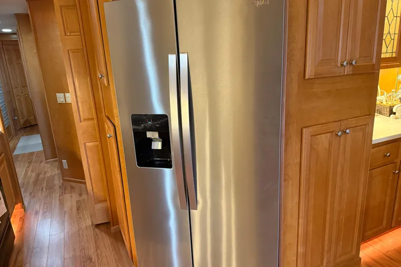 Slide: The Image of Stainless steel refrigerator in a wooden kitchen, Sharpe 80 X 18, 2001 model. - 87