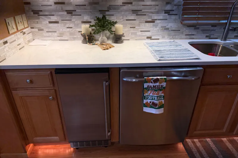 Slide: The Image of Modern kitchen with stainless steel appliances, decorative towel, and elegant backsplash. - 92