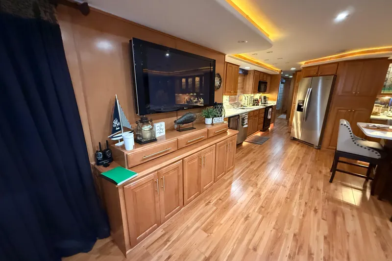 Slide: The Image of Luxurious interior of a 2001 Sharpe 80 X 18 houseboat with modern kitchen and wooden flooring. - 96