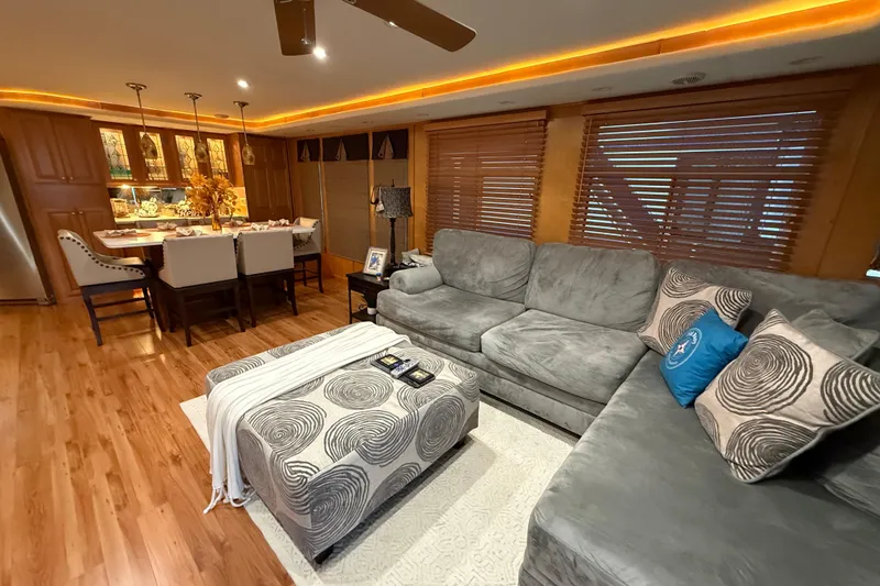 Slide: The Image of Luxurious houseboat interior with cozy seating, elegant dining area, and warm lighting, Sharpe 80 X 18, 2001. - 97