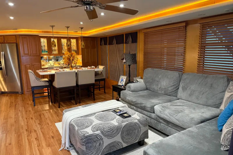 Slide: The Image of Luxurious houseboat interior with modern kitchen, cozy seating, and elegant lighting, Sharpe 80 X 18, 2001. - 99