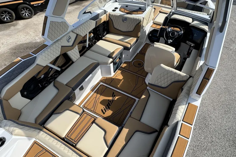 Slide: The Image of Luxurious interior of 2026 Tigé 24RZX boat with premium seating and modern dashboard. - 10