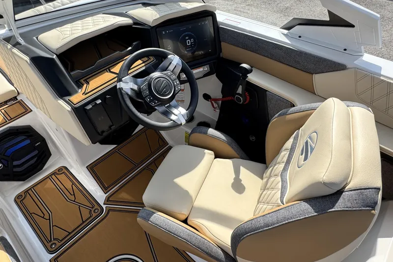 Slide: The Image of 2026 Tigé 24RZX boat interior with modern steering wheel and luxurious seating. - 11