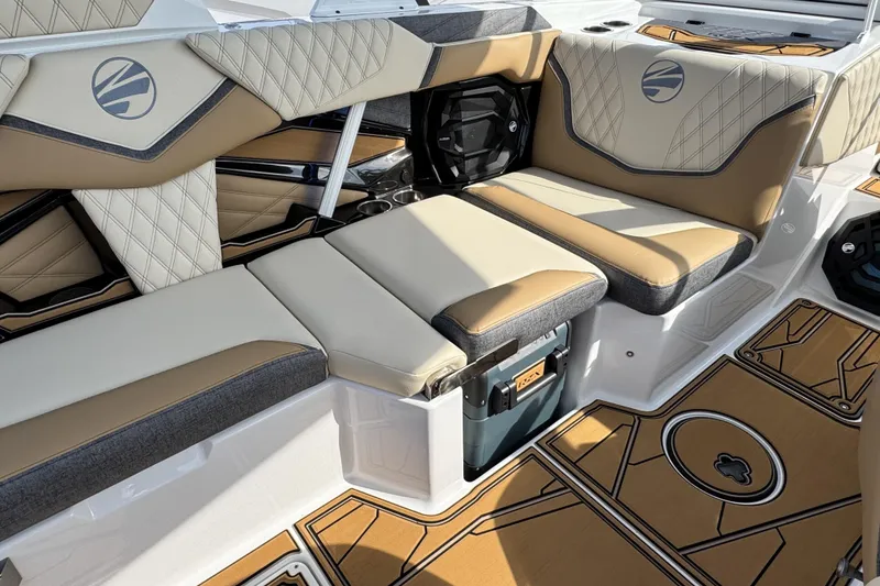 Slide: The Image of 2026 Tigé 24RZX boat interior with tan and gray seating, stylish design. - 13