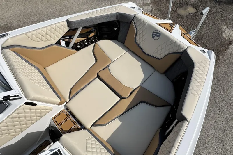 Slide: The Image of Luxurious interior of 2026 Tigé 24RZX boat with beige and tan seating. - 14