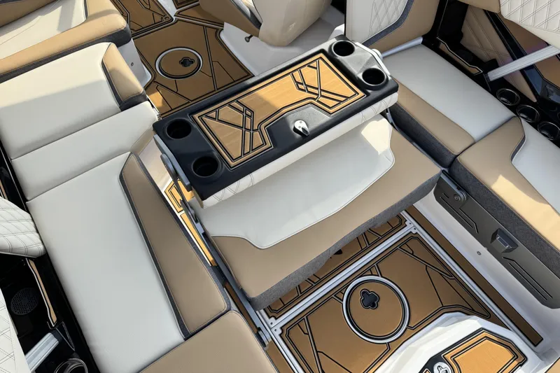 Slide: The Image of 2026 Tigé 24RZX boat interior with tan and white seating, stylish flooring, and cup holders. - 17