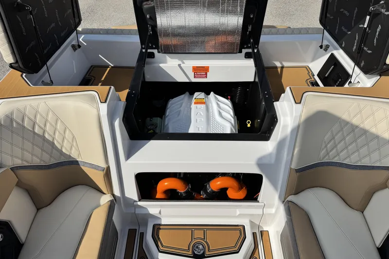 Slide: The Image of 2026 Tigé 24RZX boat engine compartment with luxury seating and detailed upholstery. - 19