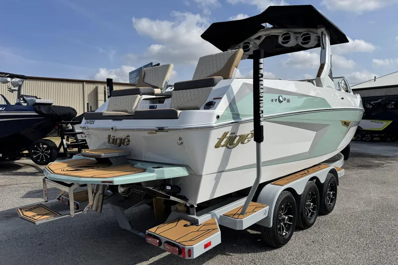 Slide: The Image of 2026 Tigé 24RZX boat on trailer, featuring sleek design and modern amenities. - 3