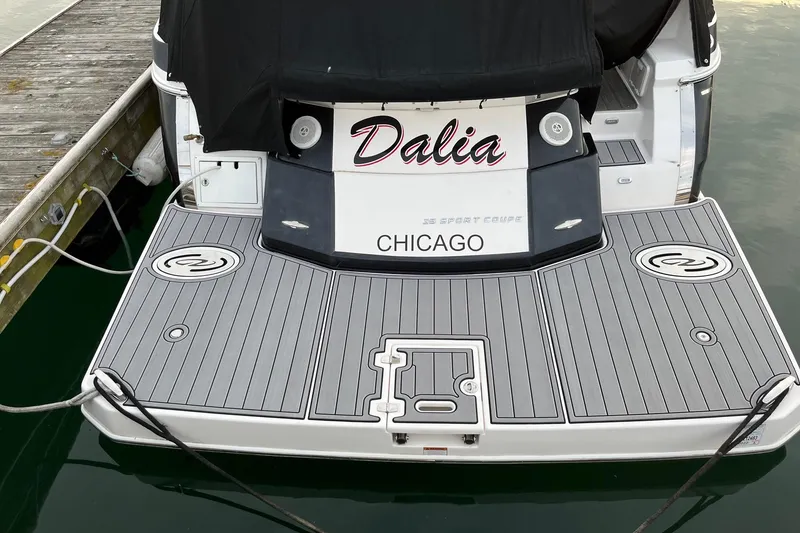 Slide: The Image of 2014 Regal 35 Sport Coupe with vibrant LED lights at night dock. - 11