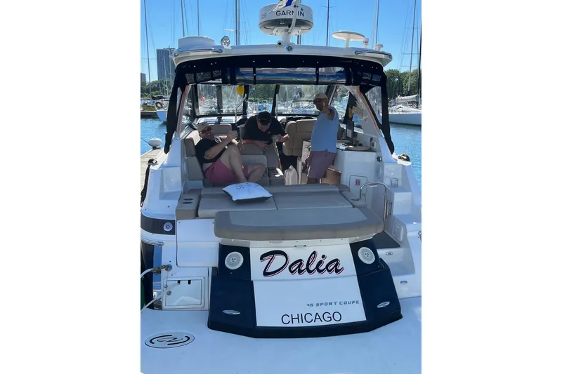 Slide: The Image of 2014 Regal 35 Sport Coupe boat with seating, docked in Chicago. - 17